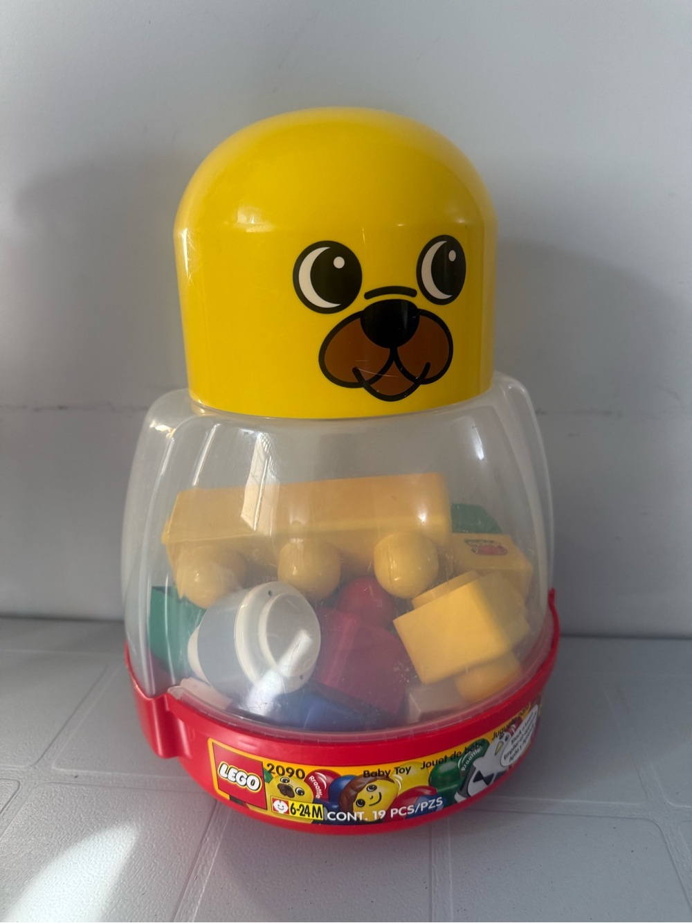 Vintage Lego Yellow Bear-Head Baby Stacking Toy with Clear Body and Red Base